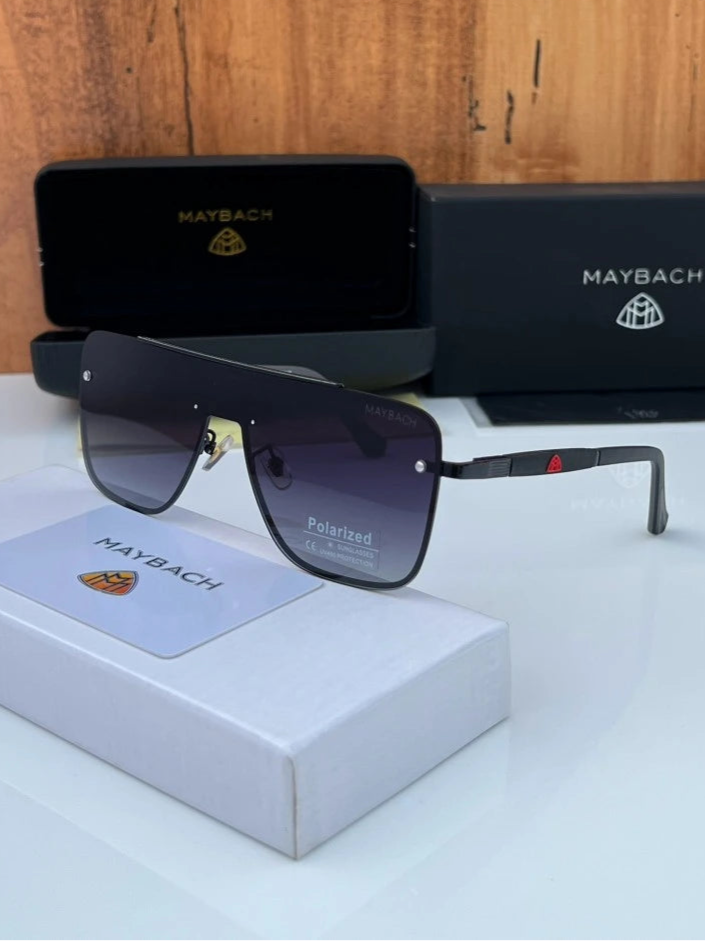 Maybach sunglasses with case and box on a wooden surface